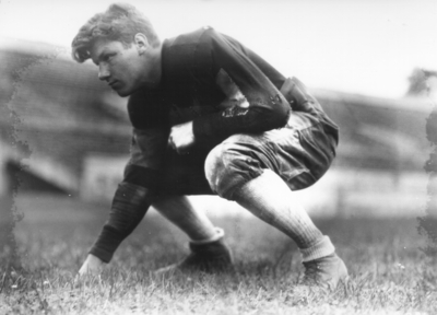 Kentucky football player in three point stance