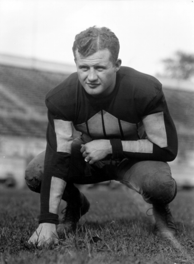 Kentucky football player in three point stance