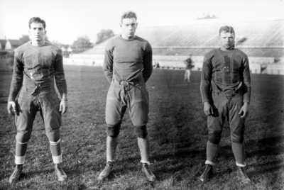 Three Kentucky football players, Stoll Field and McLean Stadium