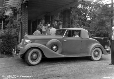 Eleanor Roosevelt (President Franklin D. Roosevelt's spouse) in car, people gathered at Maxwell Place, including Dr. Frank L. McVey and Governor Ruby Laffoon