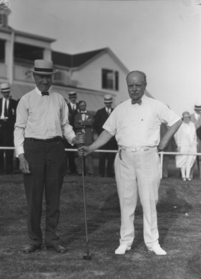 Convention, Dean F. Paul Anderson right, Engineering and unidentified man holding golf club, Lexington Country Club