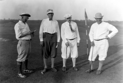 Convention of American Society of Heating and Ventilating Engineers, four unidentified men golfing.  Left to right: Haynes?, J.J. Lyle, Thorton Lewis,  unidentified man, Lexington Country Club