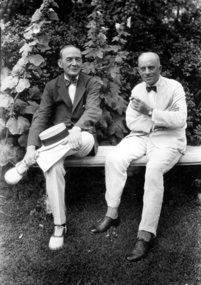 Two men seated on a bench