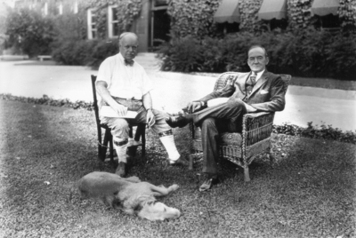 Dean F. Paul Anderson, Engineering, his dog and unidentified man, seated