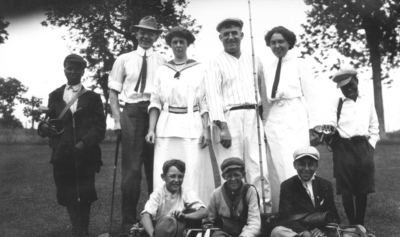 Group photograph, golf outing, two African American boys, three white boys, two white men and two white women