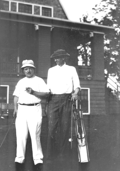 Dean F. Paul Anderson, Engineering, and unidentified man with golf clubs