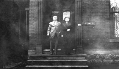 Older unidentified man and older unidentified woman on steps, Frankel Family