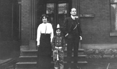 Unidentified Man and woman, and child dressed as a fireman, Frankel Family