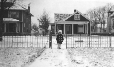 Child in winter attire on a snow-covered walkway Frankel Family (daughter)