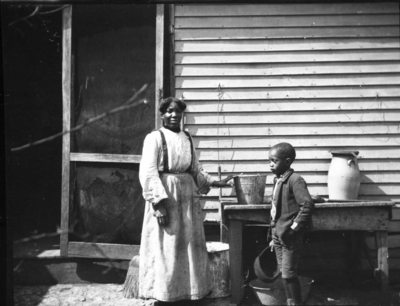 Unidentified African-American woman and young boy who worked in the Joseph Dicker (superintendent of shops) household