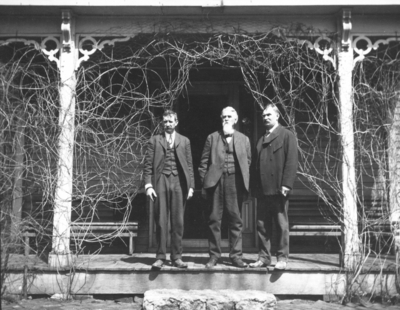 Three unidentified men on porch, Joseph Dicker Family?, Joseph Dicker, superintendent of shops on right