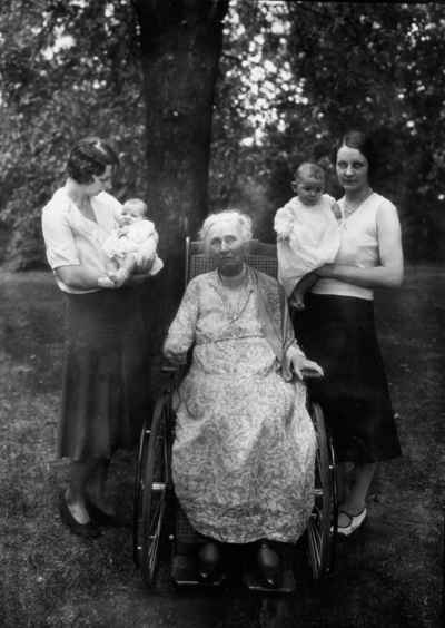 Family of President Frank L. McVey, 1917-1940, two unidentified women holding infants and President Frank L. McVey's mother in wheelchair