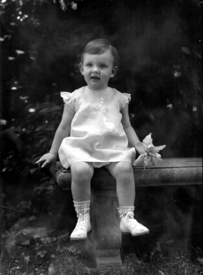 Family of President Frank L. McVey, 1917-1940, McVey grandchild seated on a bench