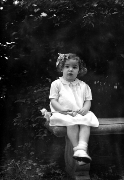 Family of President Frank L. McVey, 1917-1940, McVey grandchild seated on a bench