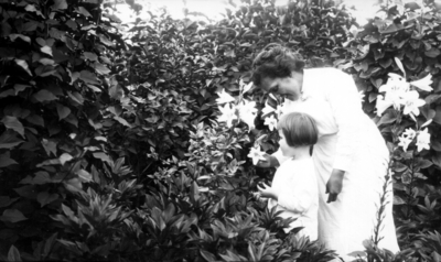 Unidentified woman and child in garden