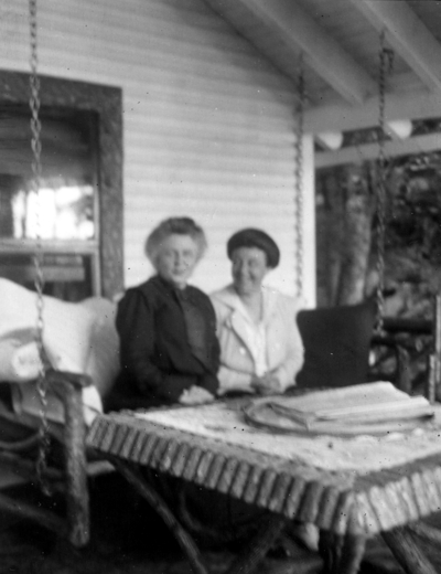 Two unidentified women on porch