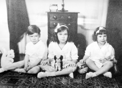 Three unidentified children with toys