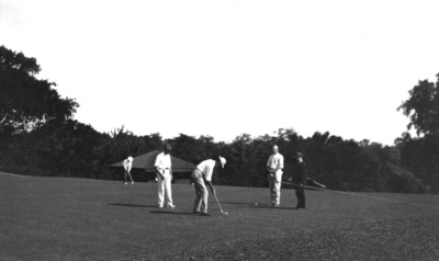 Unidentified men golfing