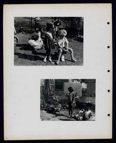 Four children playing, African-American woman with five children around her