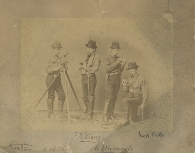 4 men (N.B. Page, C.W. Moore, C.J. Norwood, Jack Procter) with surveying equipment 1875