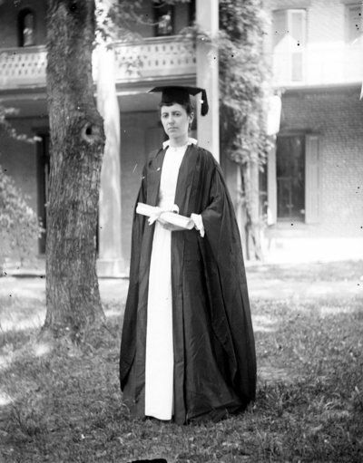 a woman dressed in a graduation cap and gown