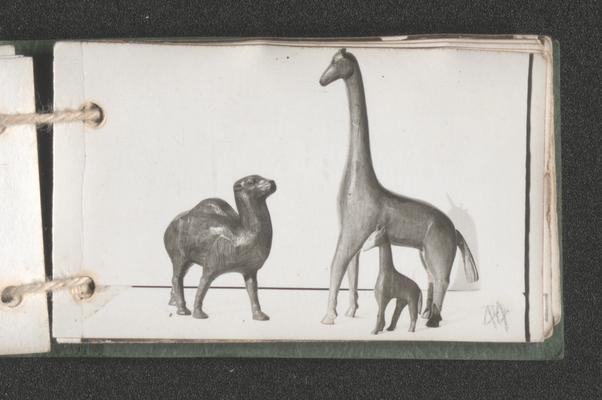 Sculpture of two giraffes and a camel