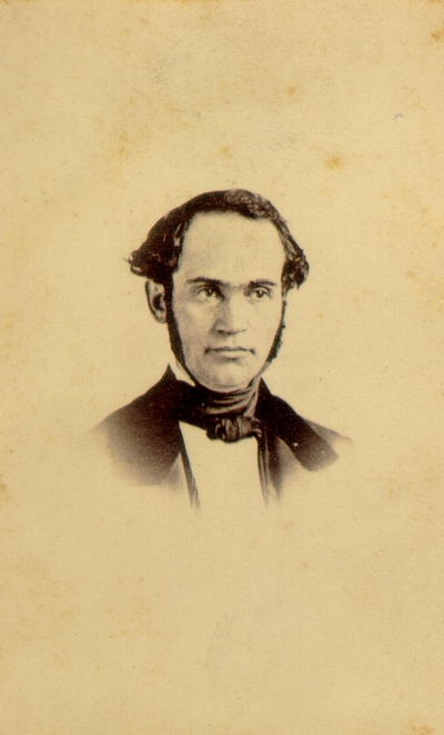 Man in suit with dark hairline and long sideburns; Three cent stamp on back