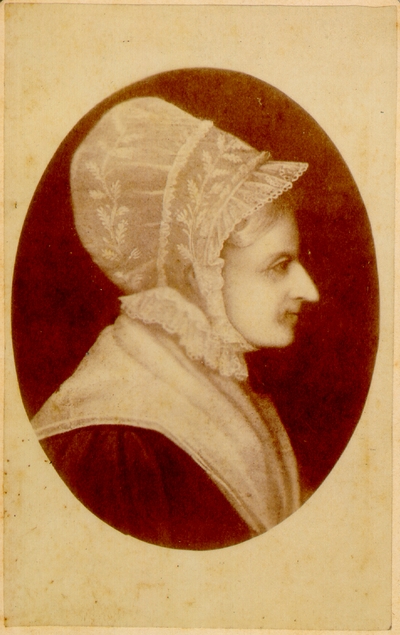 Elderly woman profile, hair in bonnet and pointy nose