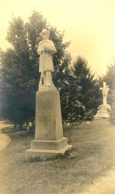 Lexington Cemetery confederate monument; Tombstone with statue at top of a confederate soldier holding a rifle