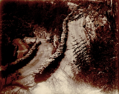 Woman posing near winding road up to Walden's Ridge, Tennessee