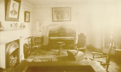 Lyle Home, possibly parlor; Sunlight coming through window; Portrait above fireplace of Joel Kenney Lyle