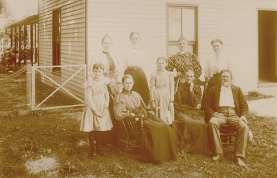 Mrs. M.C. Lyle seated with family around her