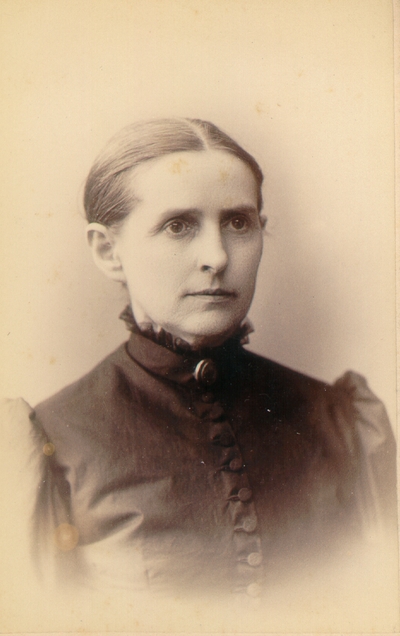 Mrs. M.C. Lyle wearing black dress