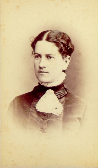 Young woman wearing dark dress with wide hair part; Western Female Seminary