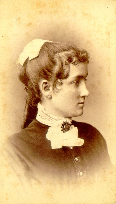 Young woman wearing dark dress with white collar; Western Female Seminary