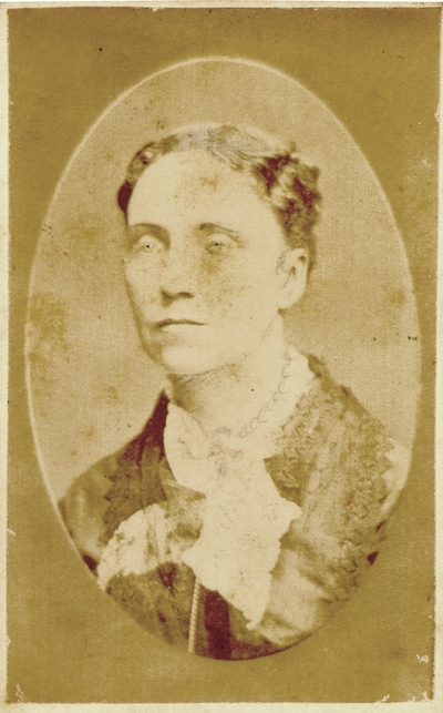 Woman wearing dark dress with some facial features drawn in; Western Female Seminary