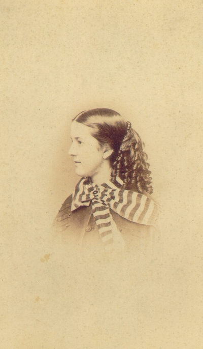 Young woman with stripped bow collar