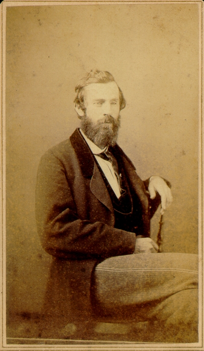Man with long beard and suit