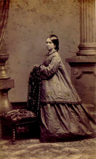 Woman wearing large wrinkled dress