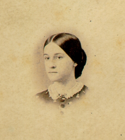 Young woman's face; Hair straight with part down middle of head