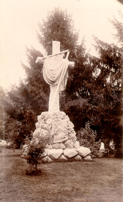 Grave site: large stone monument of a cross