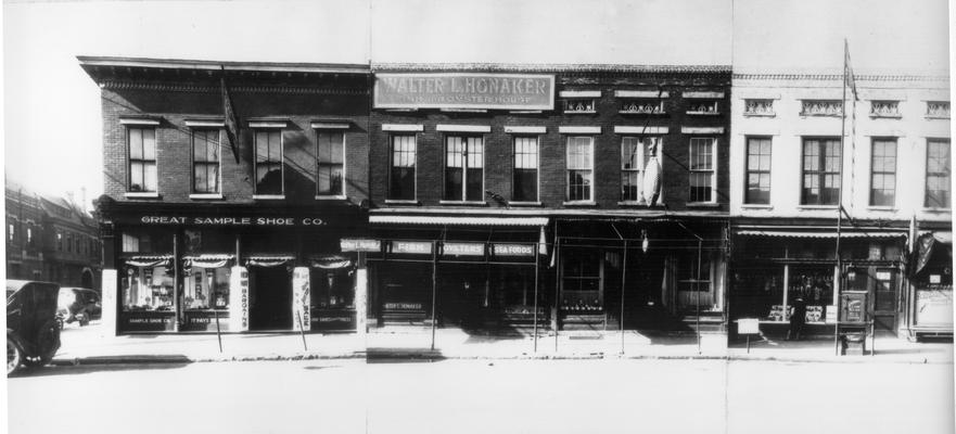 S. Upper - Water to Main (West), 121  Great Sample Shoe Co., 119  W.L. Honaker Fish and Oyster House, 117  D. Addler  &  Son, 115-113  Schange's Candies
