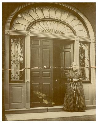 Henrietta Hunt standing in the doorway of Hopemont (Hunt-Morgan House)