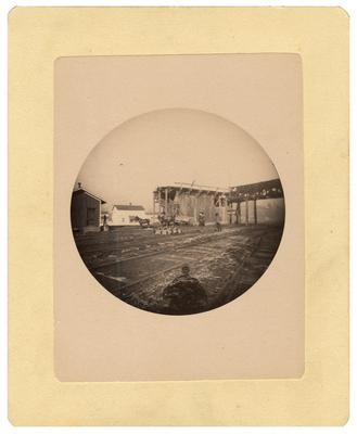 Unidentified man by railroad tracks; removed from pg. 3 of album