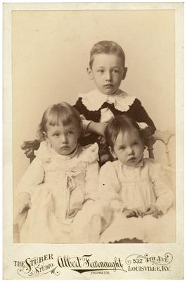 Three unidentified children; removed from pg. 23 of album; handwritten on back in pen                              Cary 4 yrs 2 ms / Bessie 1 yr 10 ms Marion 2 yrs 10 ms