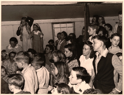 Part of the audience in the evening services of the Pentecostal Church of God.  More than 300 persons were crowded into a narrow, hot unventilated room; the aisles were packed solid; the door was closed with a wall of people watching and listening from outside.  Lejunior, Harlan County, KY. 9/15/46