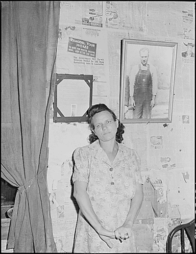 Mrs. Leanore Miller, widow of a miner, with a picture of her husband.  She said,  