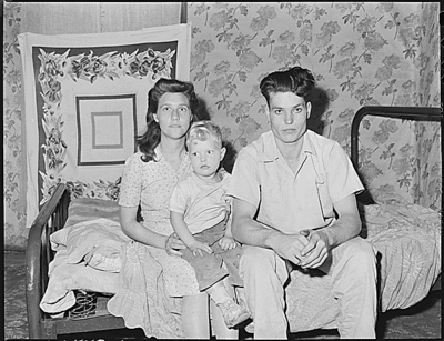 Rufus Sergent, his wife and son.  Rufus is a son of Blaine Sergent, a coal miner for 48 years.  Rufus has been working in the mines since he was 15, quitting school in the fourth grade.  He is now a cutter.  Lejunior, Harlan County, KY.9/13/46