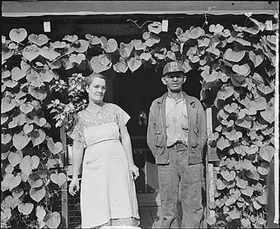 Mr. and Mrs. Tudor Circo on their front porch.  Raven, Tazewell County, Va. 8/28/46