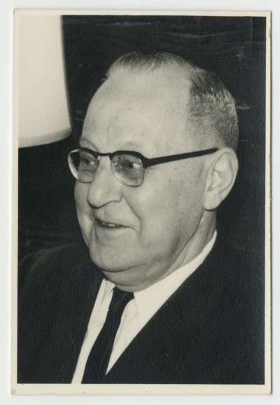 Man in glasses [E.J. Kohn?]